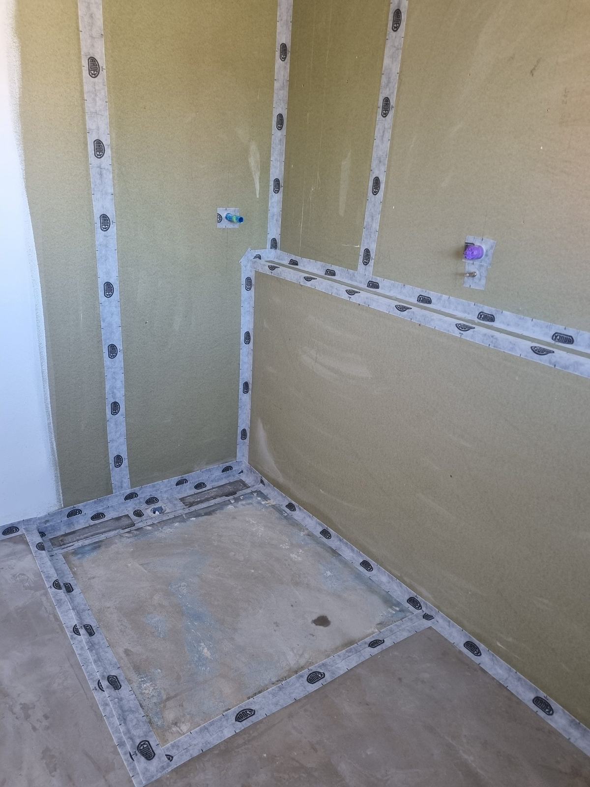 ARDEX tape on every wall joint and around the shower tray and pipe penetrations
